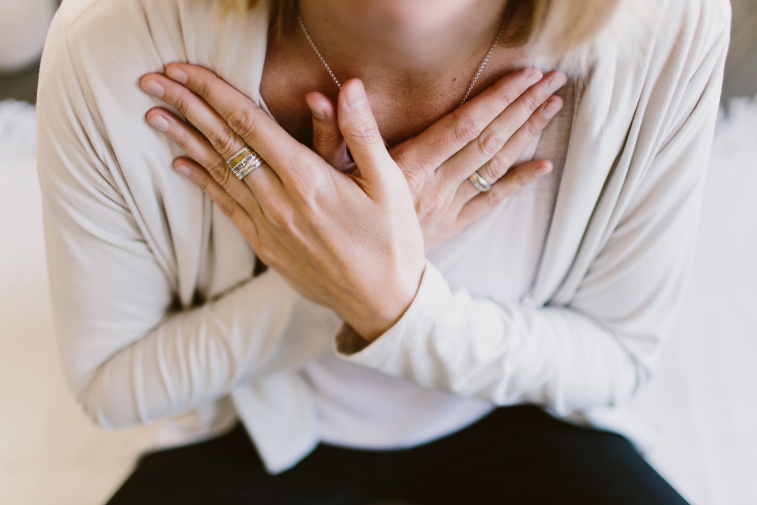Woman with hands crossed over her heart - Spiritual Therapist and Counselor Novus Modo